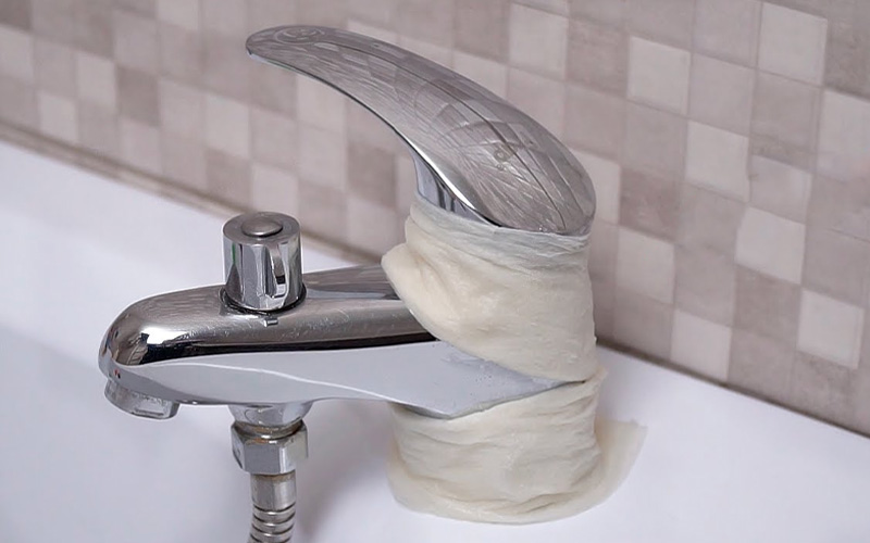 Why You Should Try Wrapping Paper Towels Around Your Faucets